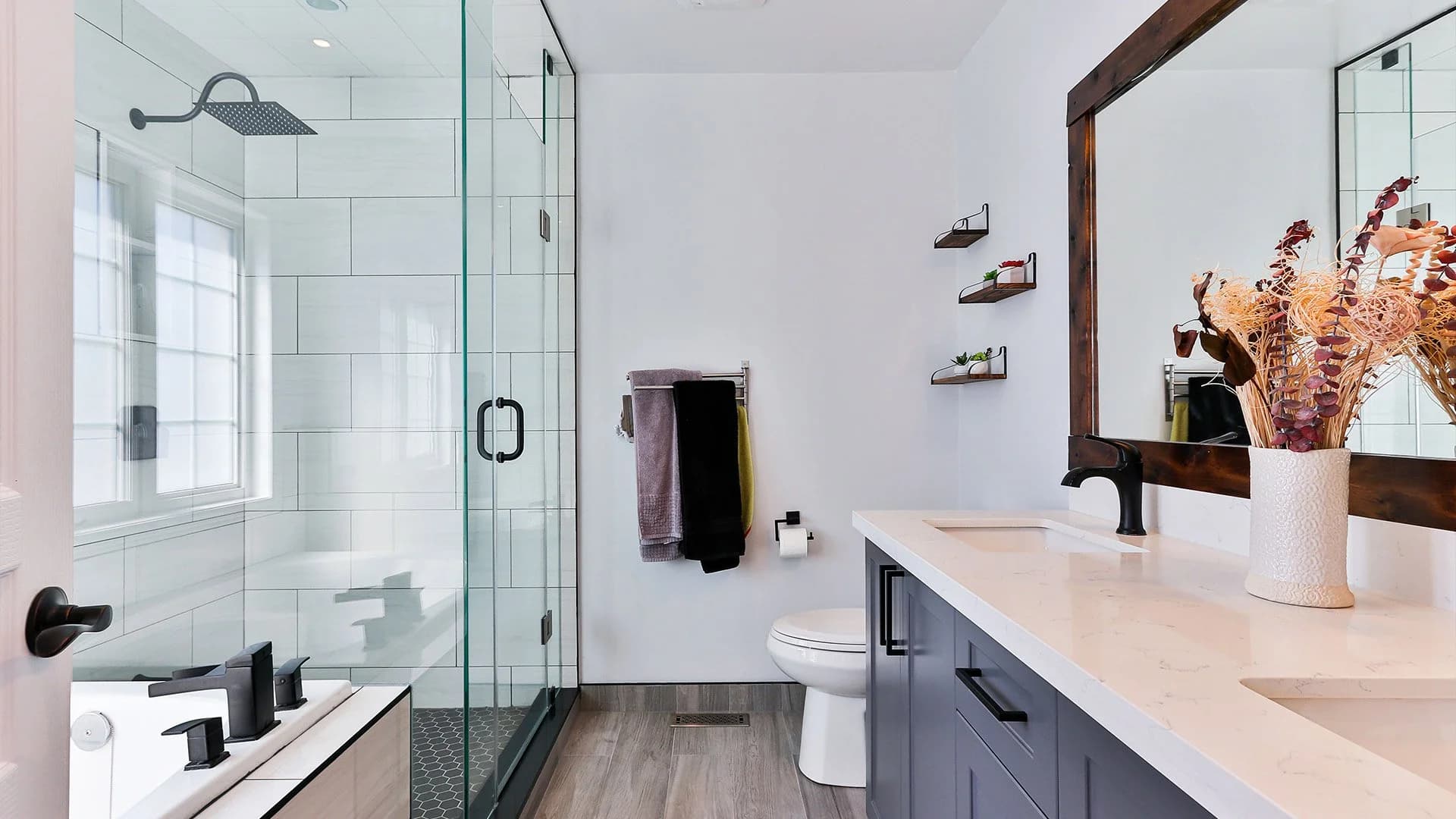 Spotless bathroom with glass shower screen and polished fittings after an end of tenancy deep clean